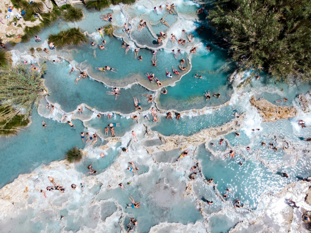 saturnia people bathing in natural pools