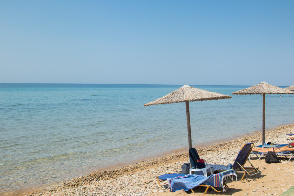 Corfu Greece Travel Guide: Sunbeds at halikounas beach