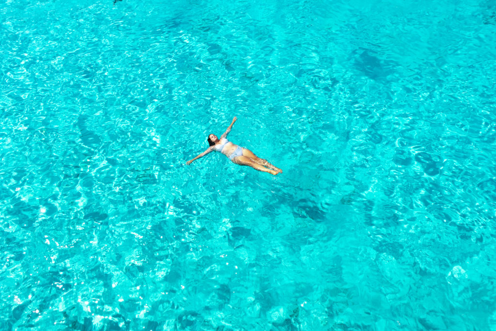 Corfu Greece Travel Guide: floating in the water of Antipaxos